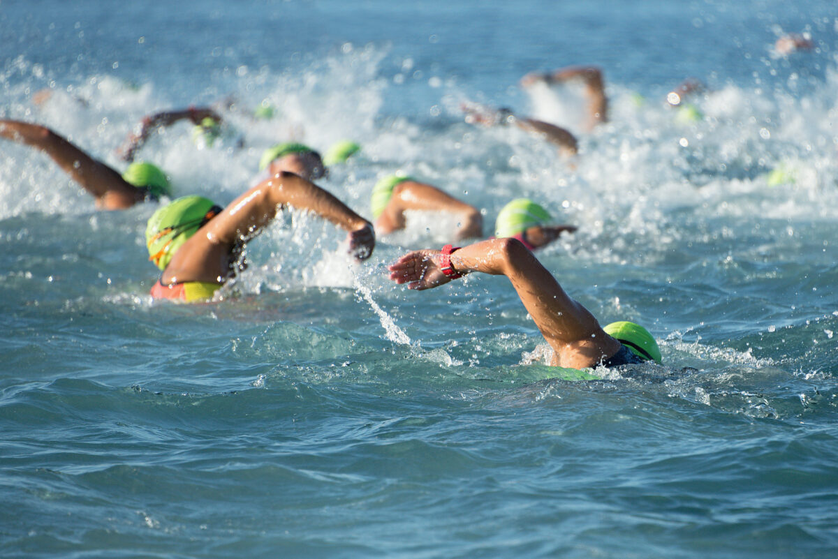 Group,People,In,Wetsuit,Swimming,At,Triathlon